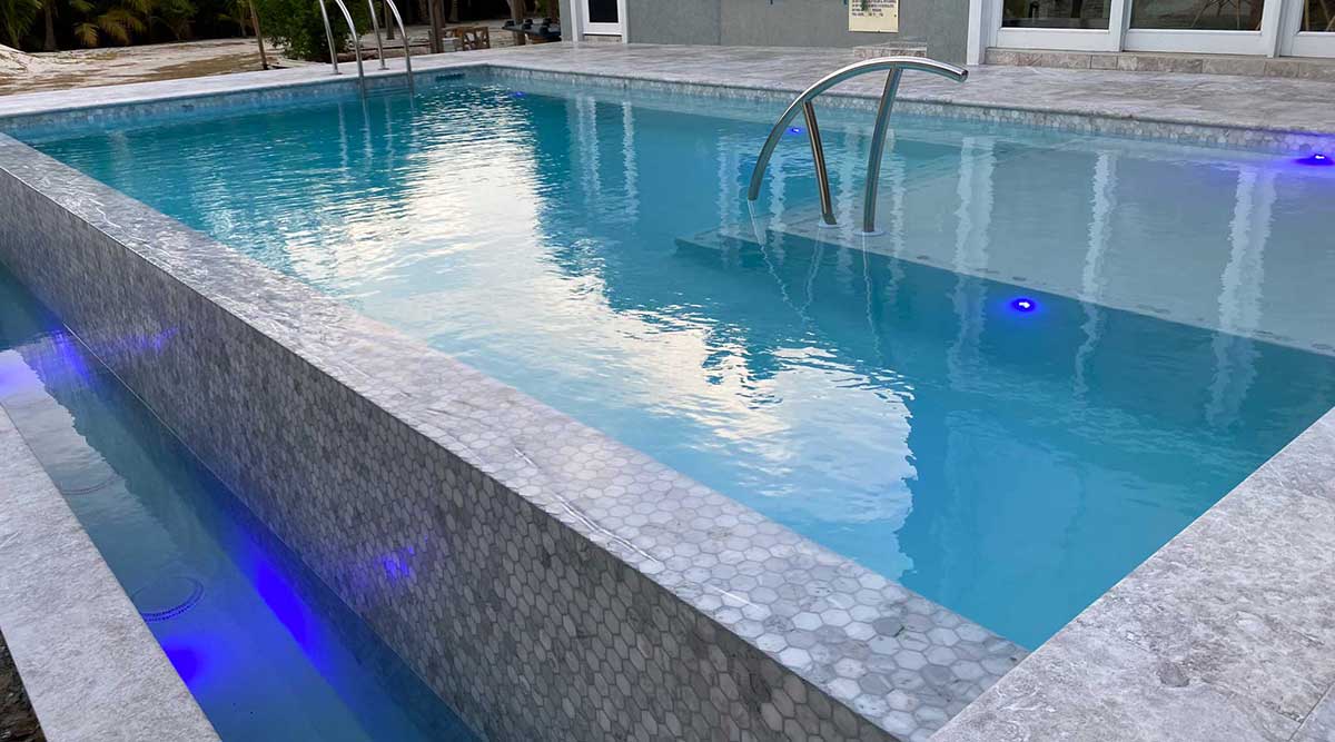 Golden Hour Grandeur: A Cayman Kai Infinity Pool